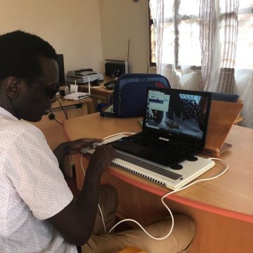 Blind man using a compuer