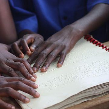 Children reading braille